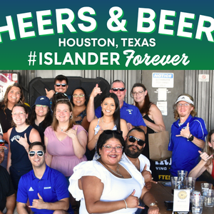 Group of Texas A&M University-Corpus Christi alumni posing together and smiling at a "Cheers & Beers" alumni mixer event in Houston, Texas. The group includes individuals of various ages and some are holding drinks. "Islander Alumni Association" and "#ISLANDERForever" are prominent in the design.