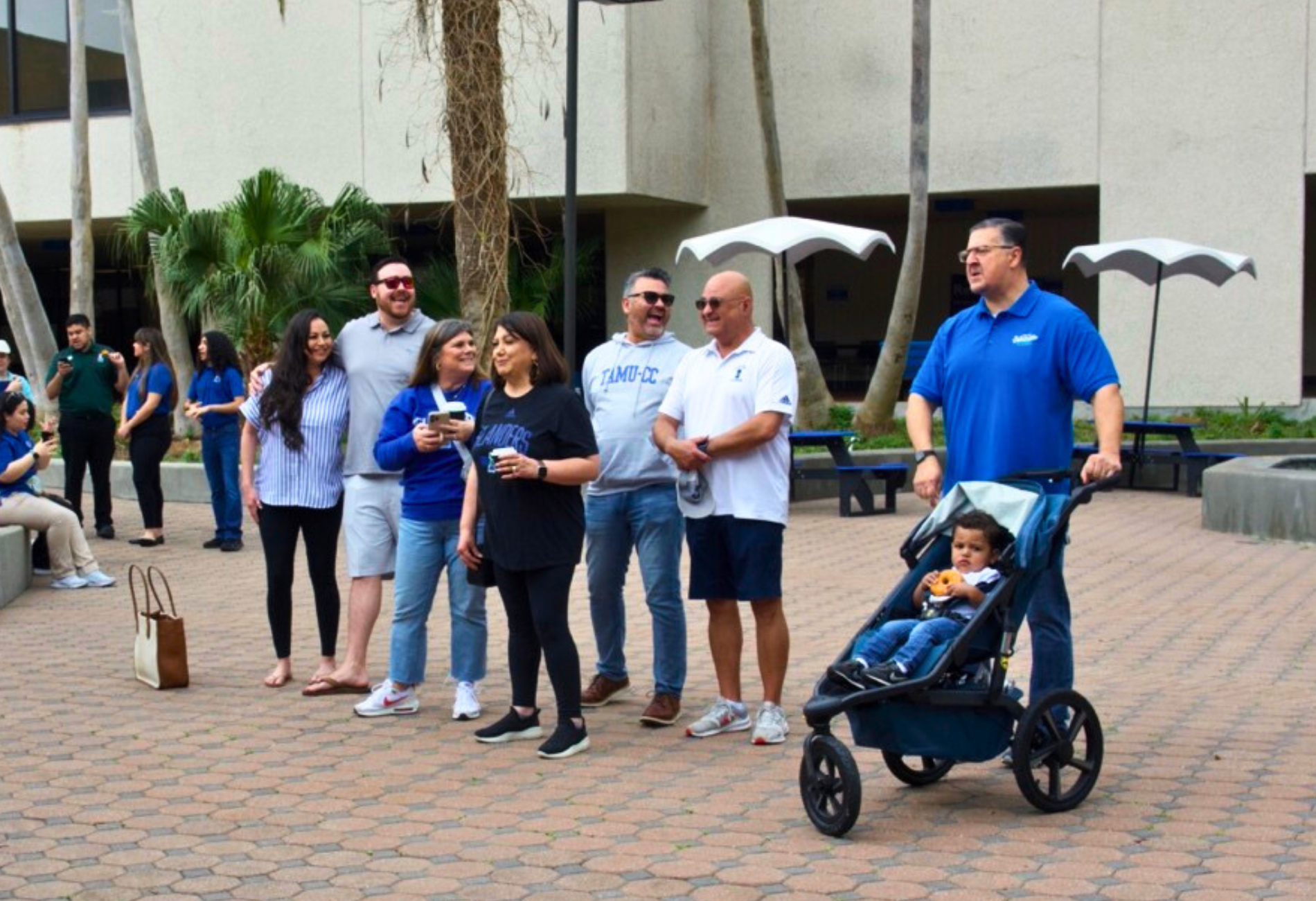 Islander Alumni enjoy the start of their campus tour with singing along with Mariachi de la Isla in Garcia Plaza during Homecoming 2023.